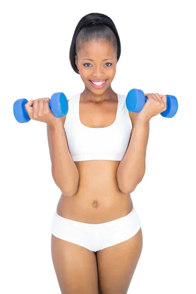 Ajuste sonriente mujer haciendo ejercicio con mancuernas —  Fotos de Stock