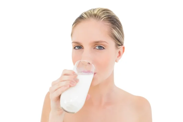 Dreamy fresh blonde woman drinking milk — Stock Photo, Image