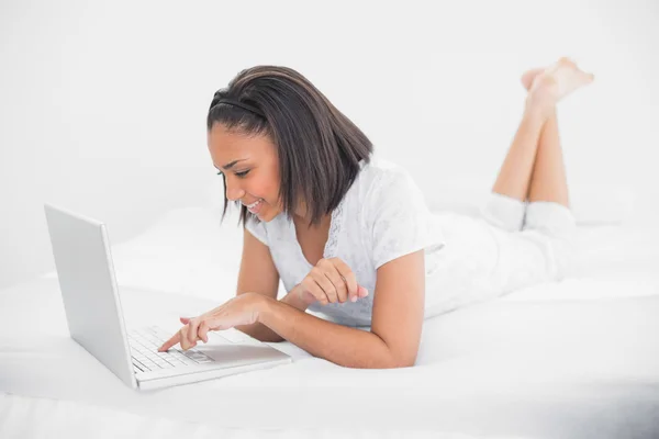 Content young model using a laptop — Stock Photo, Image