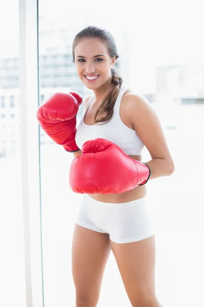 Happy sporty wearing red boxing gloves — Stock Photo, Image