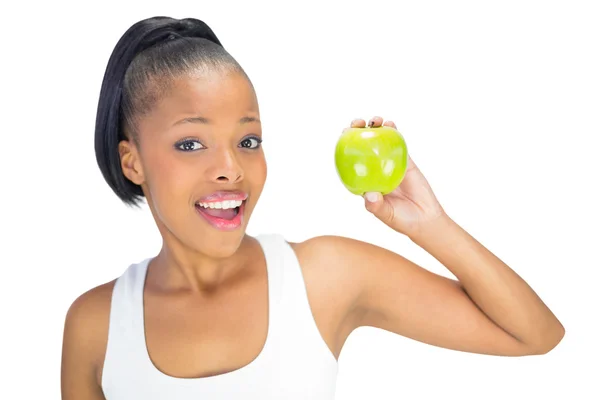 Szczęśliwy pasuje kobieta gospodarstwa zielone jabłko — Zdjęcie stockowe