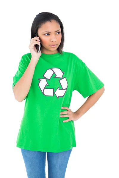 Unsmiling environmental activist making a phone call — Stock Photo, Image