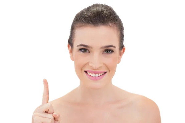 Pleased model raising her finger — Stock Photo, Image