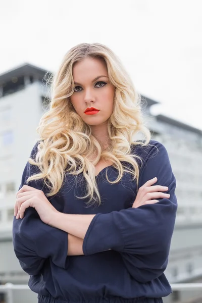 Serious gorgeous blonde with red lips posing outdoors — Stock Photo, Image