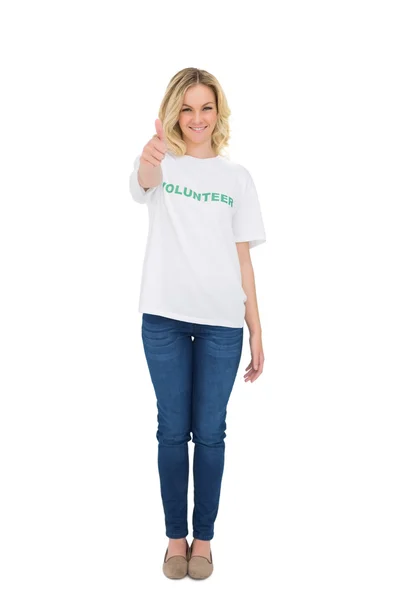 Happy blonde volunteer giving thumb up to camera — Stock Photo, Image