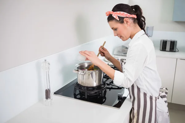 Focused gorgeous cook mixing vegetables — Stock Photo, Image