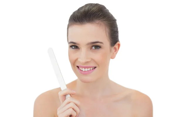 Gorgeous model holding a nail file — Stock Photo, Image