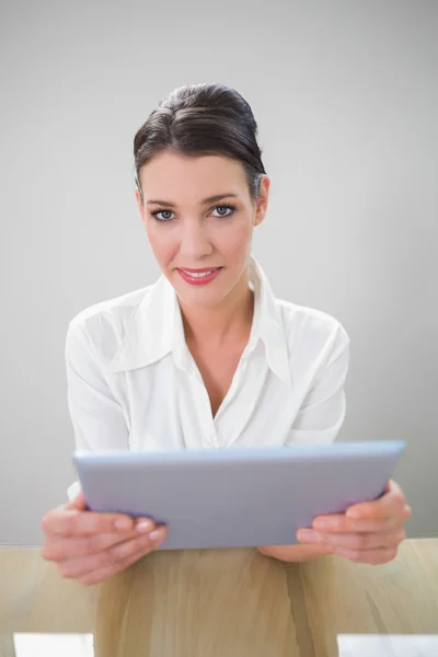 Smiling businesswoman working on tablet pc — Stock Photo, Image