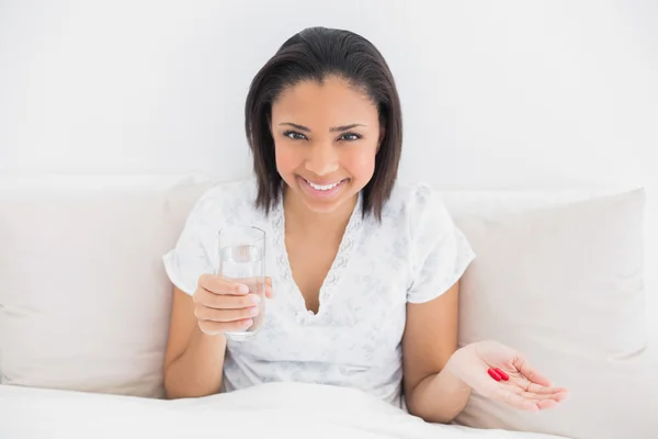 Content young model taking medication — Stock Photo, Image