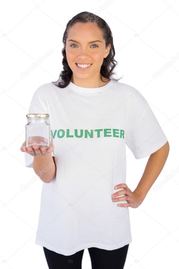 Pretty volunteer woman holding jar