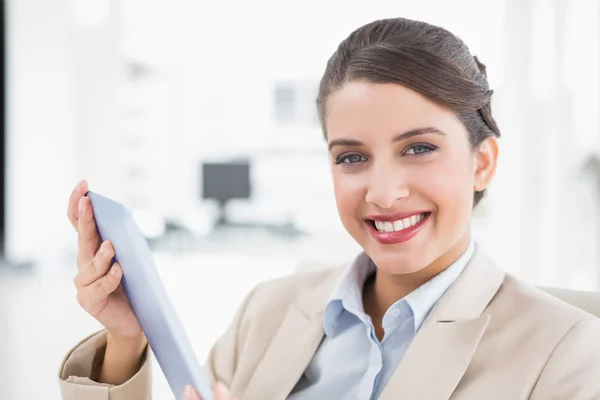 Amused businesswoman using a tablet pc — Stock Photo, Image