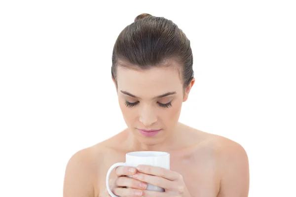 Relaxed model holding a mug of coffee — Stock Photo, Image