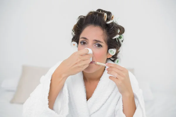 Sad natural brunette blowing her nose — Stock Photo, Image