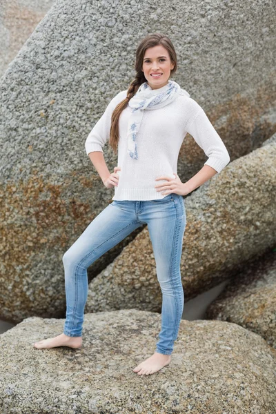 Confident young model posing with hands on the hips — Stock Photo, Image