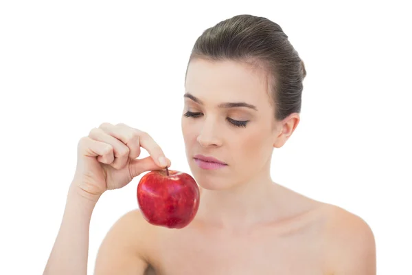 Charming model holding an apple — Stock Photo, Image