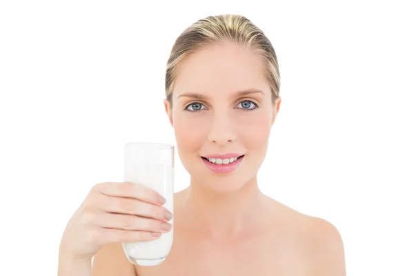 Peaceful fresh blonde woman holding a glass of milk — Stock Photo, Image