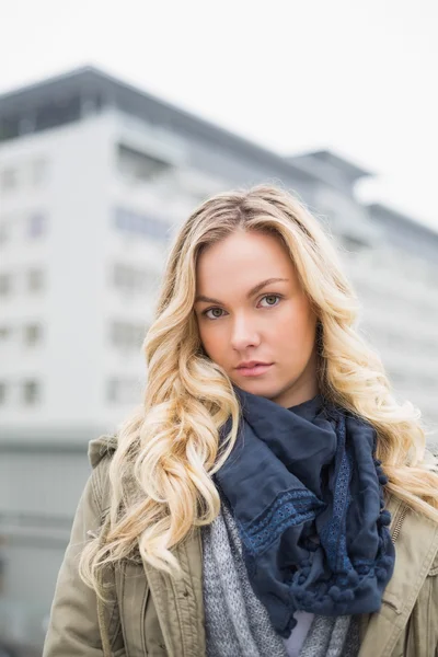 Unsmiling attractive blonde posing outdoors — Stock Photo, Image