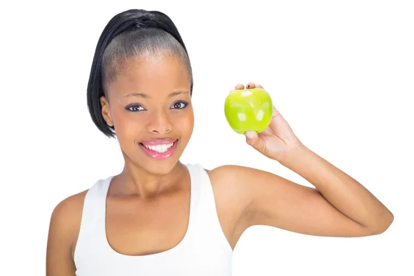 Attraktive Frau in Sportkleidung mit grünem Apfel — Stockfoto
