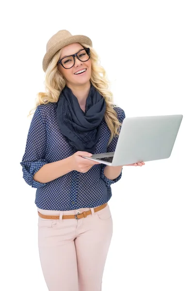 Happy trendy blonde holding laptop — Stock Photo, Image