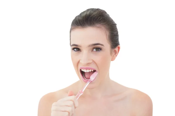 Lovely model brushing her teeth — Stock Photo, Image