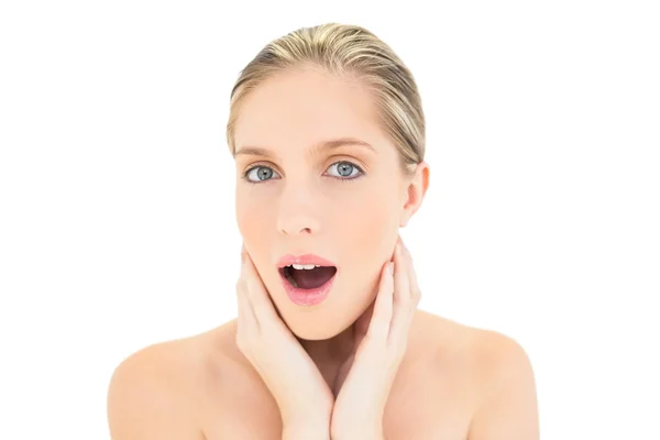 Surprised fresh blonde woman looking at camera — Stock Photo, Image