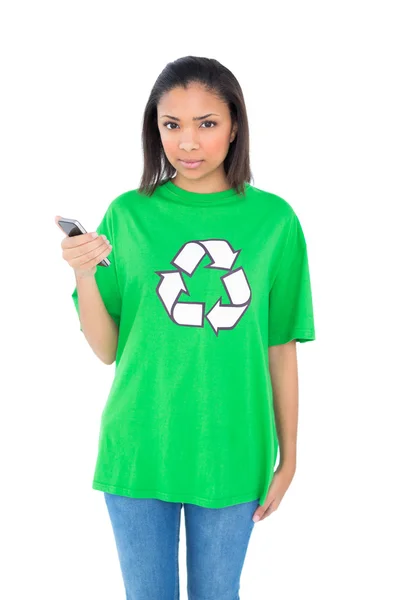 Stern environmental activist holding a mobile phone — Stock Photo, Image
