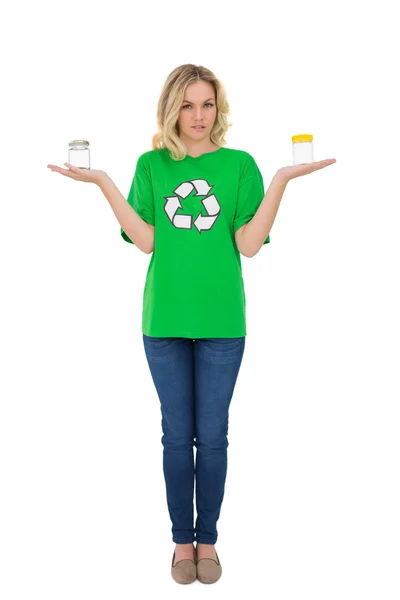 Serious cute environmental activist holding glass jars — Stock Photo, Image