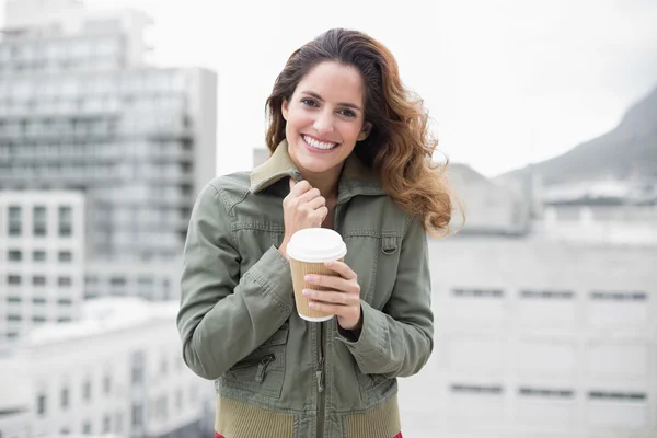 Brunette in winter fashion holding disposable cup — Stock Photo, Image