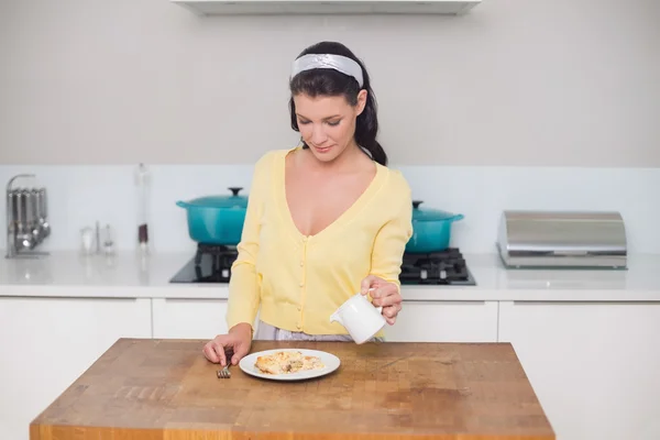 Peaceful cute brunette having dessert — Stock Photo, Image