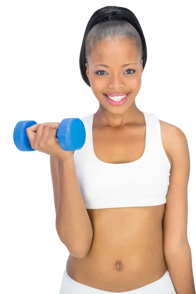 Happy fit woman in sportswear working out with dumbbell — Stock Photo, Image