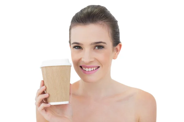 Pleased model holding a cup of coffee — Stock Photo, Image