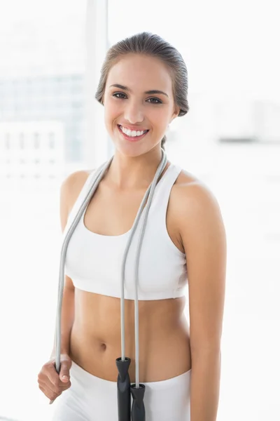 Brunette wearing a skipping rope around the neck — Stock Photo, Image