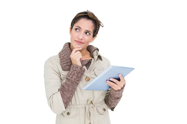 Brunette in winter fashion holding tablet — Stock Photo, Image