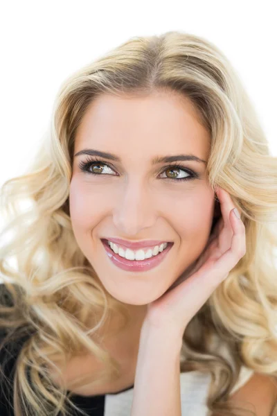 Cheerful blonde model looking up Royalty Free Stock Photos