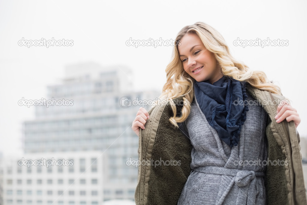Cheerful beautiful blonde posing outdoors
