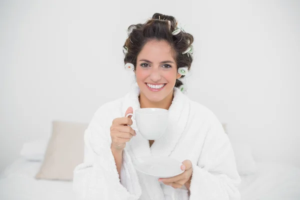 Smiling natural brunette holding a mug — Stock Photo, Image