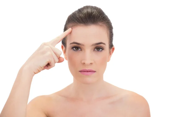 Stern model touching her brow — Stock Photo, Image