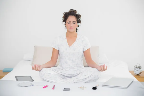 Relaxed natural brunette sitting in lotus pose — Stock Photo, Image