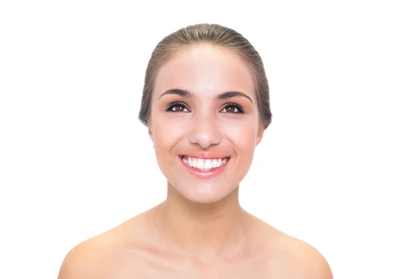 Smiling young woman looking up — Stock Photo, Image