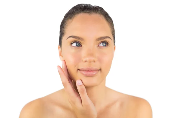 Smiling woman touching her cheek — Stock Photo, Image