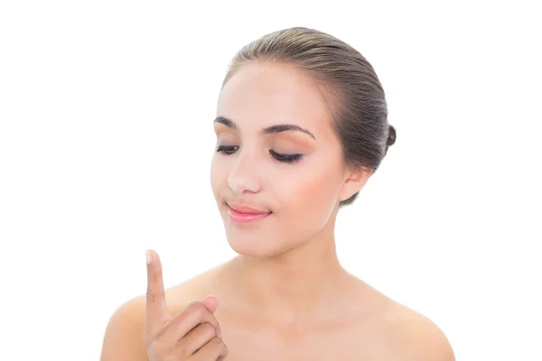 Content young woman looking at her finger — Stock Photo, Image
