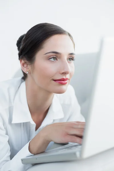 Close-up of a beautiful woman using laptop — Stock Photo, Image