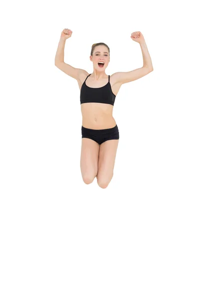 Strong slim model jumping in the air — Stock Photo, Image