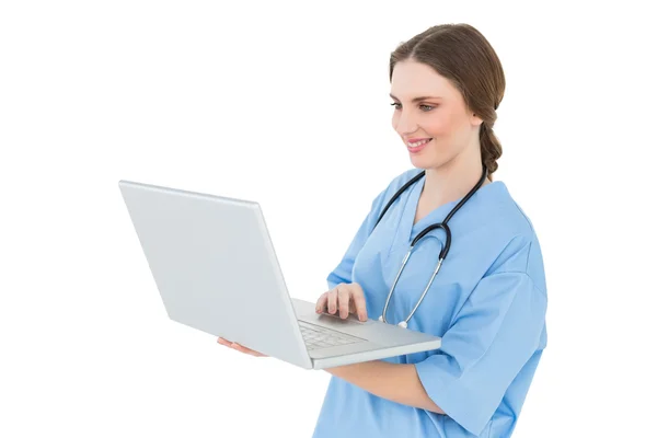 Female doctor working with her notebook — Stock Photo, Image