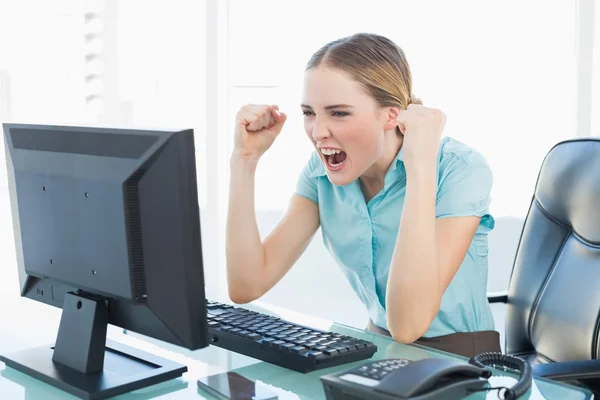 Classy cheerful businesswoman sitting in front of computer — Stock Photo, Image