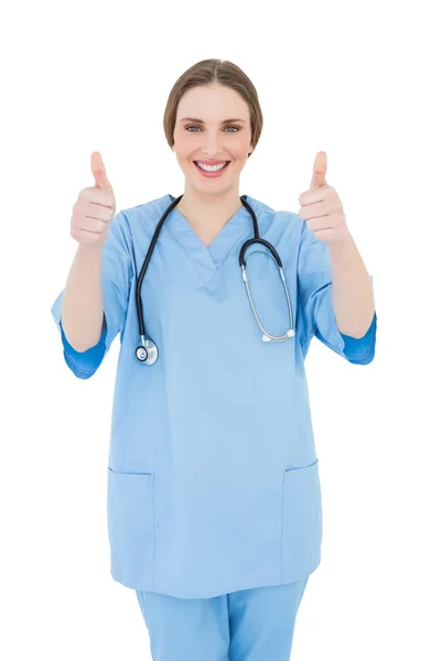 Vrouw arts haar duimen ophangen van — Stockfoto