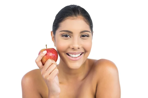 Vrolijke naakt brunette houdt van rode appel — Stockfoto