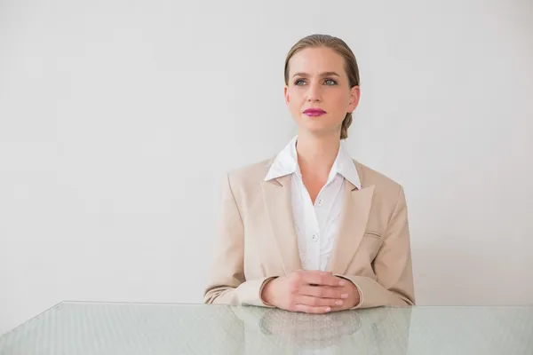 Content stylish businesswoman sitting at desk — Stock Photo, Image