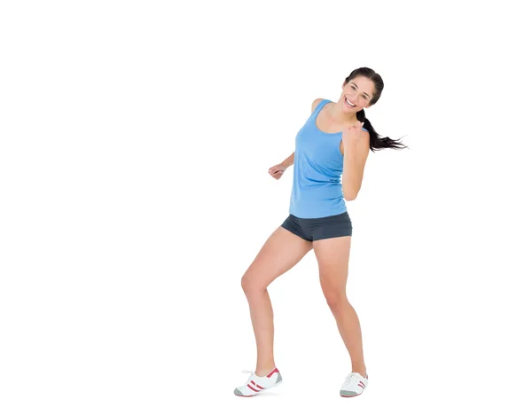 Active woman dancing over white background — Stock Photo, Image