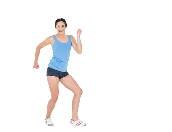 Mujer activa bailando sobre fondo blanco — Foto de Stock